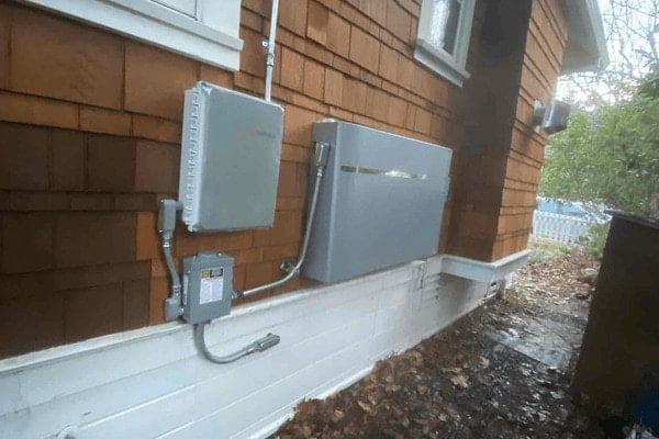 An Encharge battery on a wall