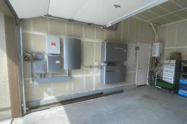 A backup battery system by Enphase in a garage